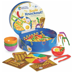 Round game box with plastic noodle pieces, bowls and cards.