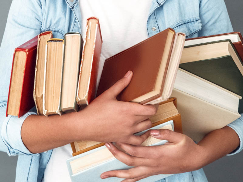 Arms full of books