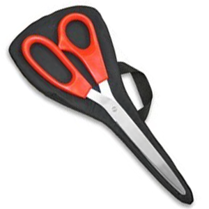 Giant ribbon cutting scissors on a carrying case